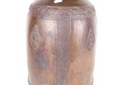 a bronze vase with a crown on top of it
