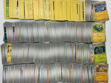 a lot of pokemon cards on the table