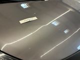 a sticker on the hood of a silver car