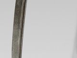 a close up of a sword with a long blade