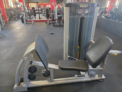 an image of a gym room with machines and weights