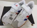 a box with a pair of white shoes on it
