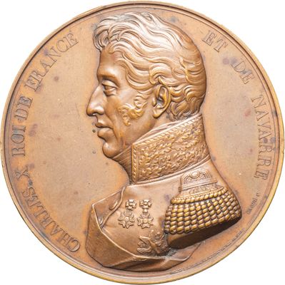 une image représentant une médaille d'or sur laquelle figure le portrait d'un homme
