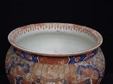 a large bowl with a design on it on a black background