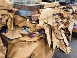 a pile of cardboard sitting on top of a desk in an office
