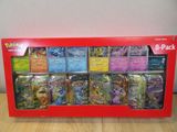 une boîte de cartes Pokémon posée sur une table en bois