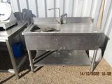 a sink that is sitting next to a table