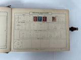 an open book with stamps on it sitting on a table