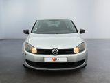 a white car that is parked in a room