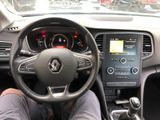 steering view of a car with a person sitting in the driver ' s seat