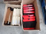 a box full of cleaning brushes and other cleaning supplies