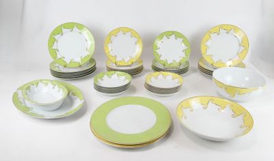 many plates and bowls that are sitting on a table