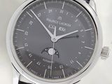 a watch that is sitting on a black leather strap
