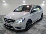 the mercedes b - class is parked on a checkered floor