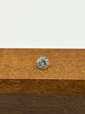a close up of a diamond on top of a wooden box