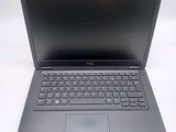 a laptop with a keyboard on a white surface