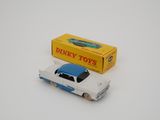 dinky toy car with box on white surface with white background