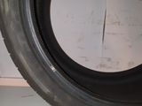 a tire on the floor with a hole in it