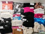 many different types of clothing on display in a box
