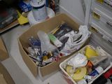 two boxes with items in them sitting on the floor