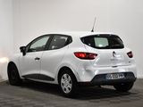 the rear end of a white car parked in a room