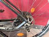 a close up view of a bicycle wheel with a chain
