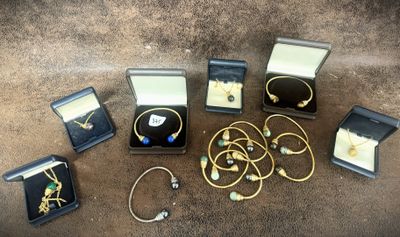 a lot of jewelry that is laying out on the floor