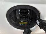 a close up of a car ' s plugged in to a charger
