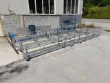 a large metal structure in the middle of a parking lot