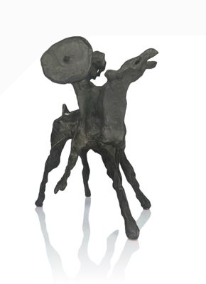 a statue of a man riding a horse holding a shield
