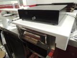 an image of a computer on top of a kitchen counter