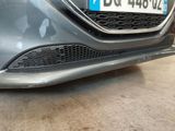 a close up of a car ' s front bumper with a number plate on it