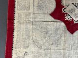 a red and white piece of cloth with a design on it