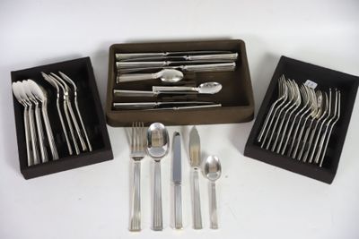 a box of silverware and a tray of forks and spoons