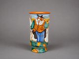 a vase with a picture of a man and a bird on it