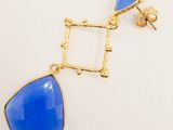 gold plated blue glass drop earrings on a white background