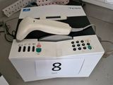 a wii controller sitting on top of a box