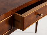 a close up of a wooden desk with a drawer underneath it