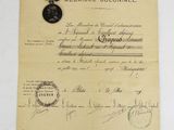 a close up of a piece of paper with a medal on it