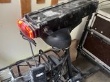 a bike that is parked in a garage with a light on