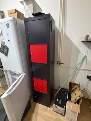 a refrigerator and a refrigerator freezer in a room