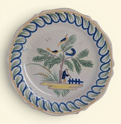 a plate with a picture of a bird on it