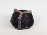 a black ring with a wooden cross on it