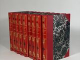 six red books lined up on top of each other on a white surface
