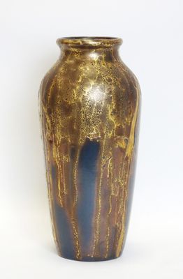 a vase that is sitting on a white surface