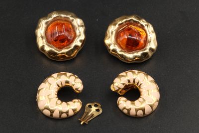 three pieces of gold and orange glass earrings and a key