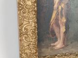 painting of a nude woman in a gold frame with a gold border