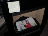 a black table with a hat on top of it