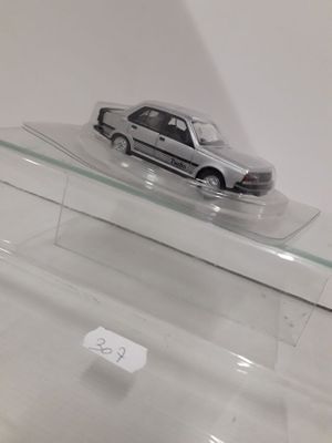 a toy car sitting on top of a clear display case