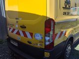 a yellow van parked in front of a building